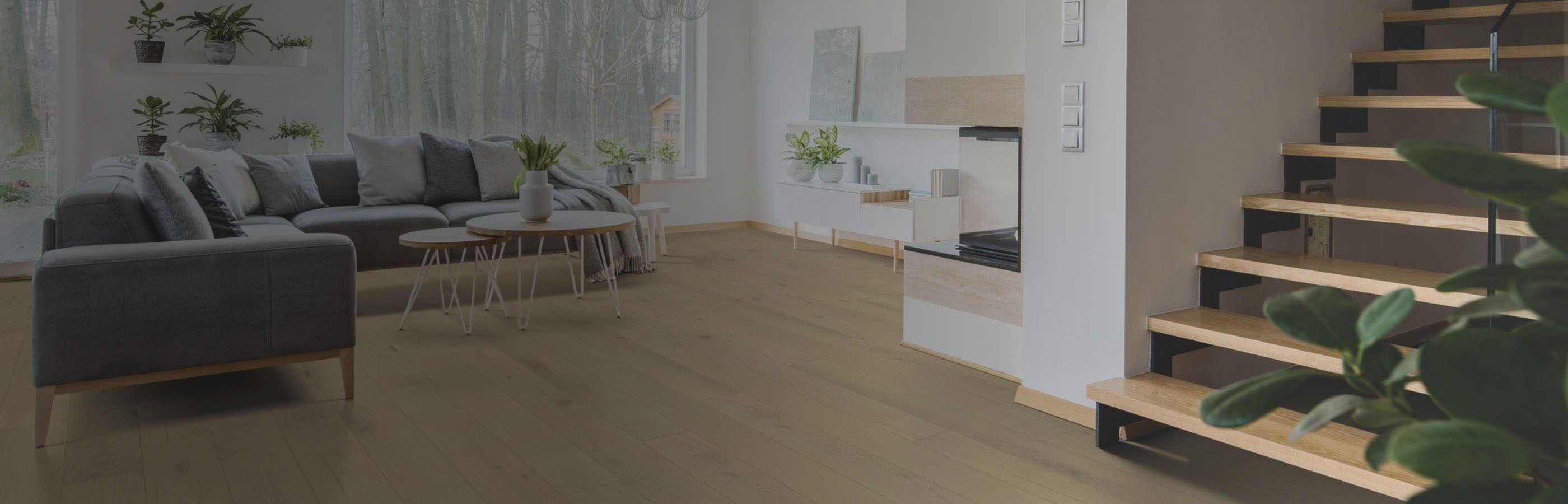 white and beige modern boho living space with natural rug and chevron wood floors